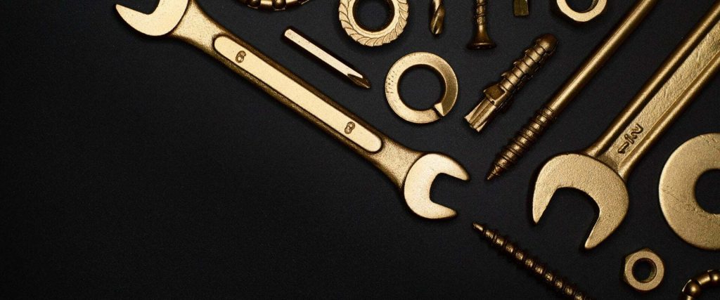 A close-up of wrenches and screws